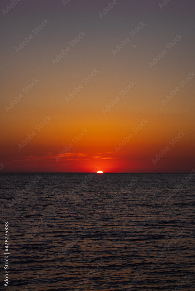 Sun setting at sea