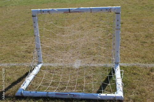Soccer goal standing by itself waiting for a game to began