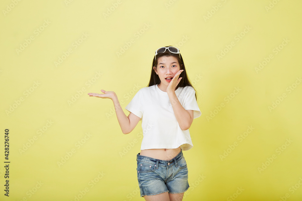 Asian woman smiling and pointing Asian woman smiling and pointing