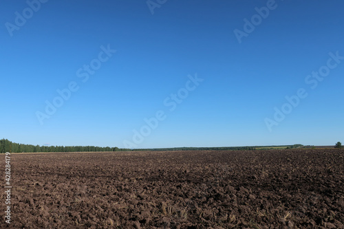 The fertile soil of an arable land was paved to cultivation of a harvest, the chernozem in an organic agricultural farm. Agriculture, landscape of the farmland.