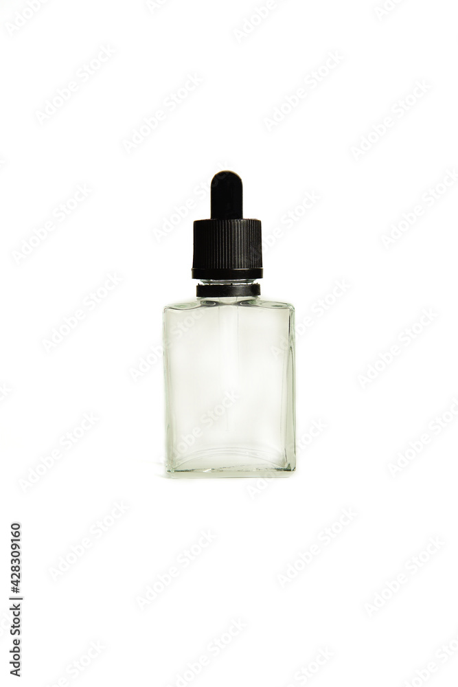 A bottle with a pipette, isolated on a white background. glass container for cosmetic skin care products. Aromatherapy, essence, or perfume is empty. a bottle of cosmetic dropper. A bottle with a pipette, isolated on a white background. glass container for cosmetic skin care products. Aromatherapy, essence, or perfume is empty. a bottle of cosmetic dropper.