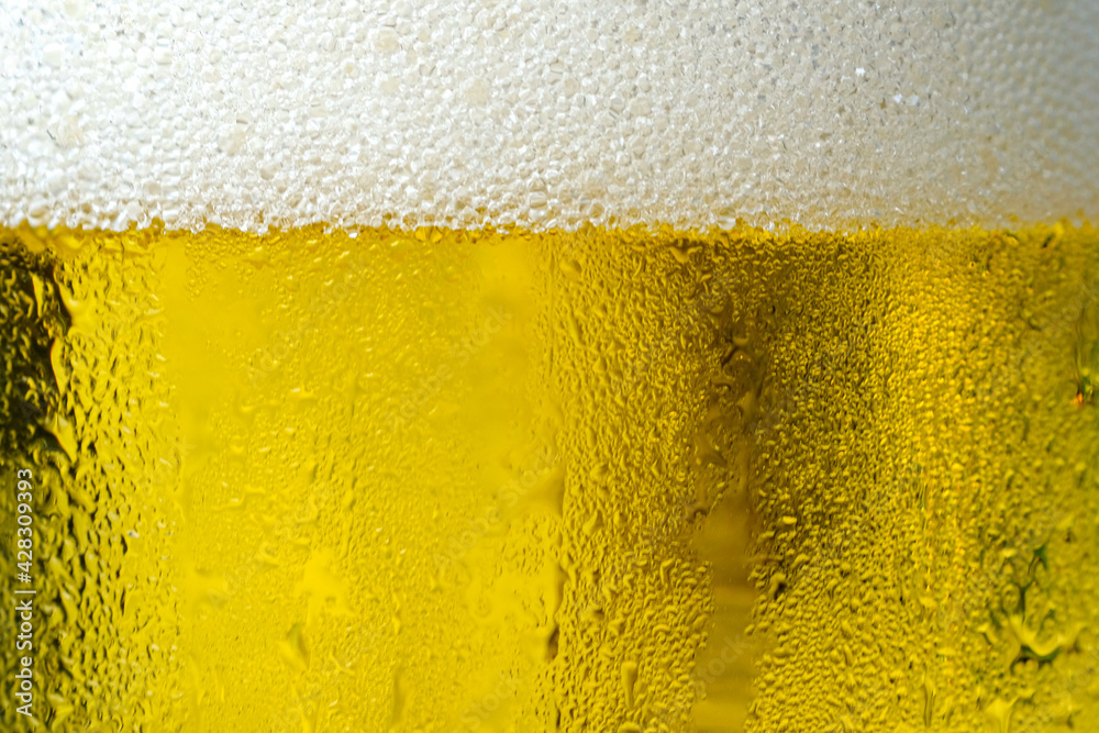 Background Cool beers with beer bubbles on top a glass at the party Background Cool beers with beer bubbles on top a glass at the party