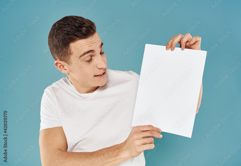 Guy with a white sheet of paper blue background advertising mocap poster Guy with a white sheet of paper blue background advertising mocap poster