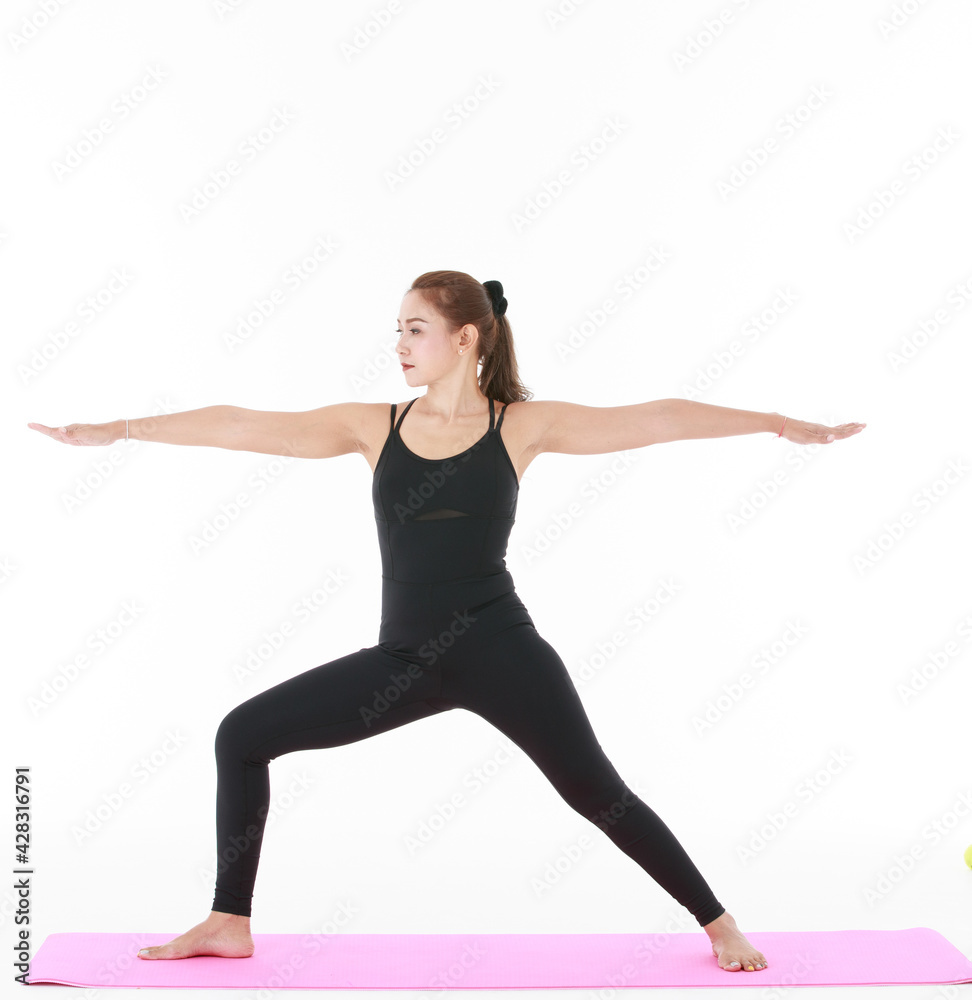 Fototapeta premium Asian woman doing yoga with outstretched arms
