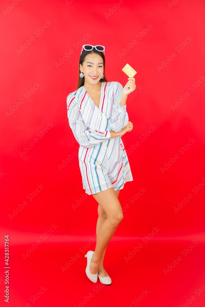 Portrait beautiful young asian woman with credit card and shopping bag Portrait beautiful young asian woman with credit card and shopping bag