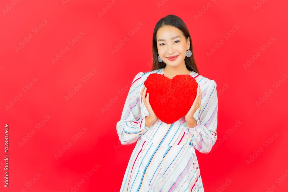 Portrait beautiful young asian woman with heart pillow shape Portrait beautiful young asian woman with heart pillow shape