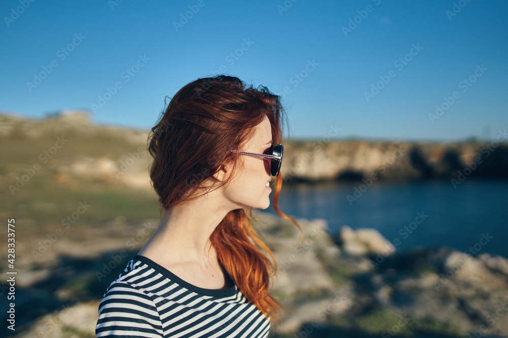 portrait of a woman in the mountains outdoors in summer t-shirt glasses landscape portrait of a woman in the mountains outdoors in summer t-shirt glasses landscape