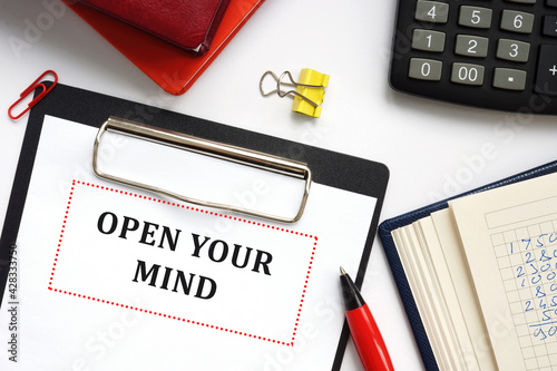 Financial concept meaning OPEN YOUR MIND with sign on the sheet.