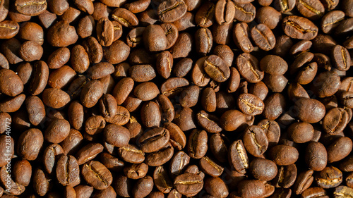 Roasted coffee beans background, arabica beans, top view, texture, close up, seed, Horizontal orientation, copy space