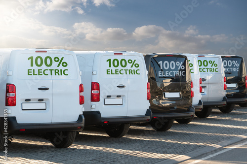 Fototapeta Electric vans parked in a row