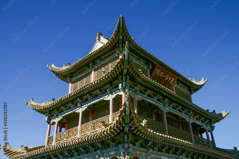 Jiayu Pass, the first frontier fortress at the west end of the Ming dynasty Great Wall. The signboard on the building is written in Chinese saying Jiayu Pass, the first frontier fortress at the west end of the Ming dynasty Great Wall. The signboard on the building is written in Chinese saying