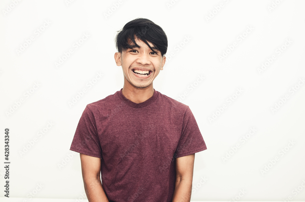 Smiling handsome Asian man in casual t-shirt Smiling handsome Asian man in casual t-shirt