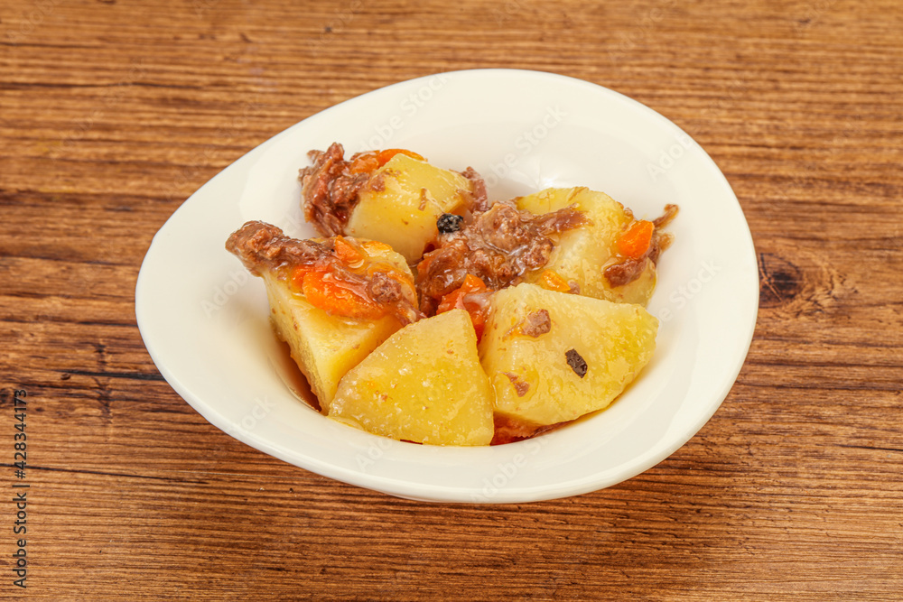Roasted potato and beef with sauce Roasted potato and beef with sauce