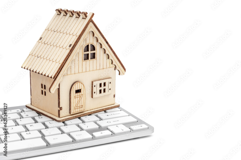 Model of house with computer keyboard on white background. Model of house with computer keyboard on white background.