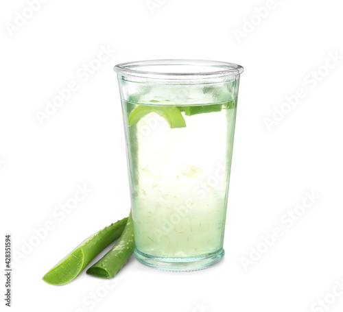 Fresh aloe drink in glass and leaves on white background