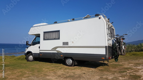 caravan trailer car by the sea in summer holidays