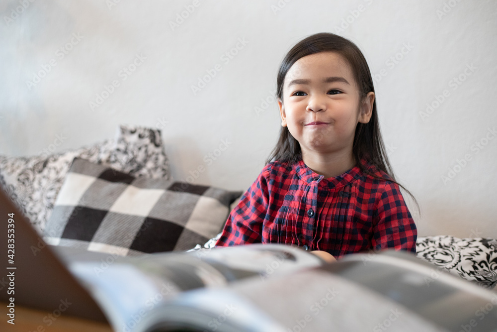 Asian Cute little girl sitting smiling and happy Asian Cute little girl sitting smiling and happy