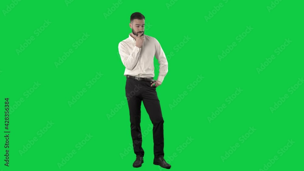 Thinking young adult business man having problem finding solution or idea. Full length on green screen chroma key background. Thinking young adult business man having problem finding solution or idea. Full length on green screen chroma key background.