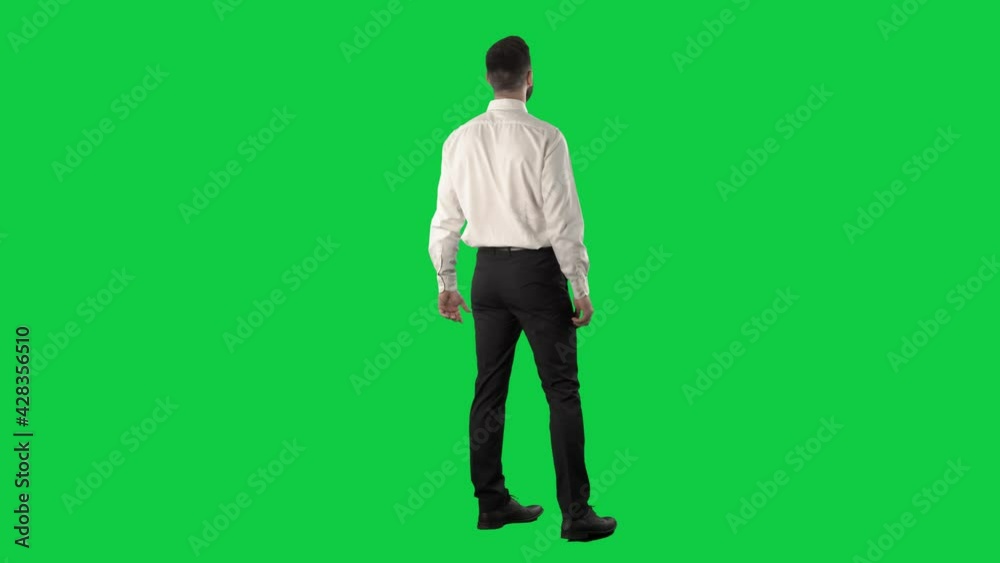 Fascinated and impressed business man looking up around and turning around shopping sales. Full length on green screen chroma key background. Fascinated and impressed business man looking up around and turning around shopping sales. Full length on green screen chroma key background.