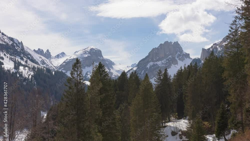 Timelapse Clouds dancing around snowy mountain peaks. View on Hundstein, Furgglenfirst. Canton Appenzell Innerrhoden, Switzerland. Timelapse Clouds dancing around snowy mountain peaks. View on Hundstein, Furgglenfirst. Canton Appenzell Innerrhoden, Switzerland.