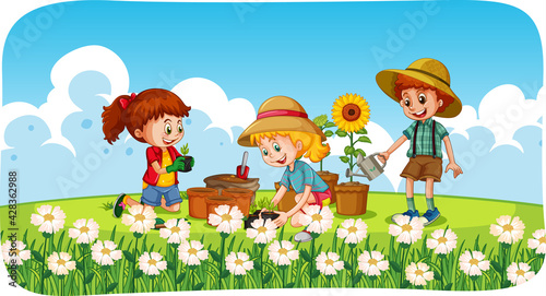 Children planting flowers in the garden