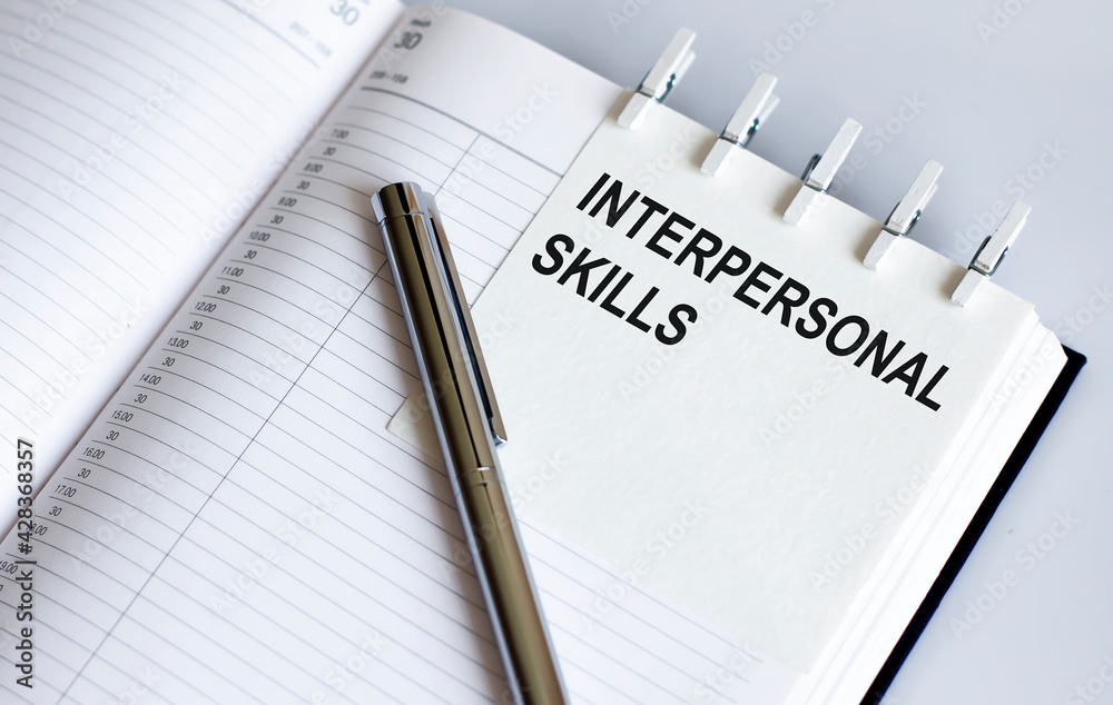 text Interpersonal skills on the short note texture background with pen. Business concept text Interpersonal skills on the short note texture background with pen. Business concept