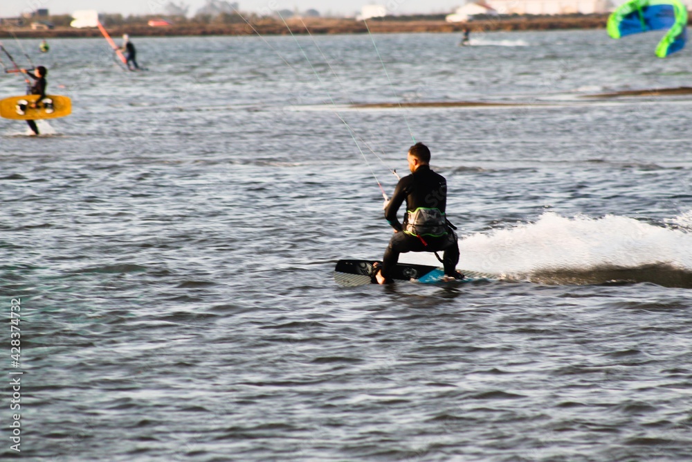 Naklejka premium surfer kitesurfing at the beach