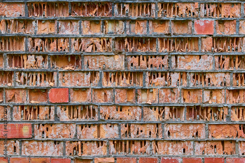 erosion, weathering and eolation of red brick walls