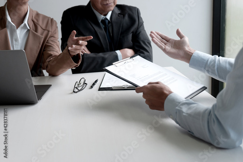 The businessman boss or hr is investigating