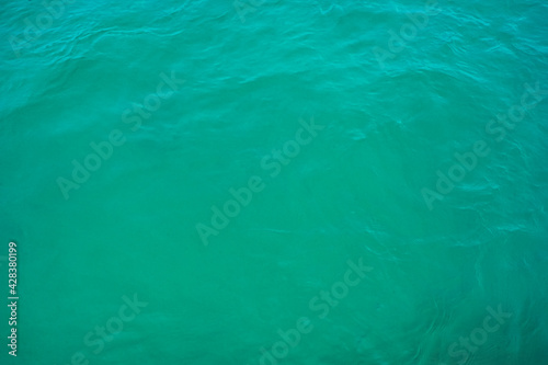 Surface texture sea blue emerald green. Turquoise sea water surface background.