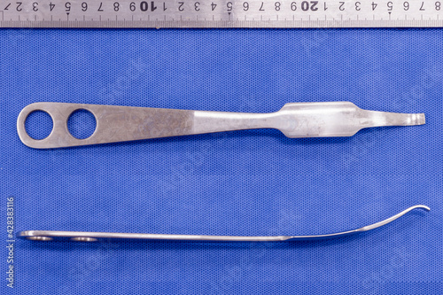 hohmann retractor on a blue background photo