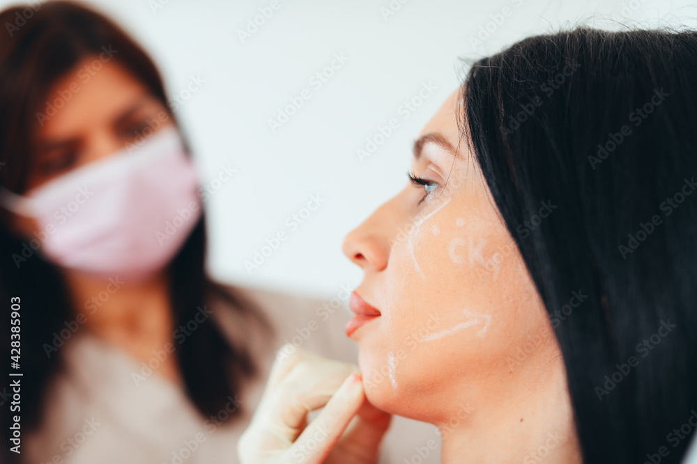 the doctor prepares the patient for aesthetic correction the doctor prepares the patient for aesthetic correction