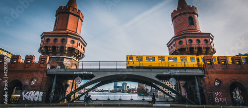 Canvas Print The Oberbaum Bridge, German Oberbaumbrucke and River Spree in Berlin, Germany