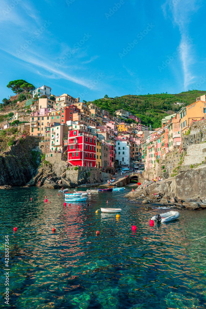 Scenic view of Riomaggiore with its colorful buildings. Cinque Terre, Liguria, Italy