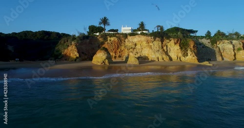 Aerial revealing view of the Alemao Beach (Praia do Alemao) in Portimão, Algarve, Portugal