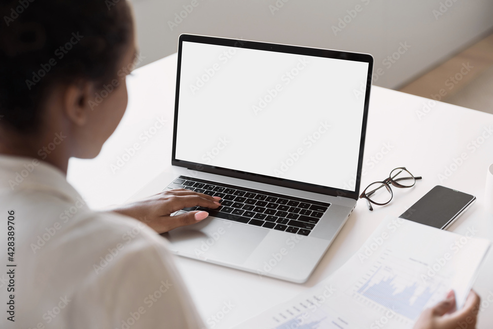 Young woman using laptop computer at home. Business woman working in office. Freelance, student lifestyle, e-learning, studying, web site, technology and online shopping concept Young woman using laptop computer at home. Business woman working in office. Freelance, student lifestyle, e-learning, studying, web site, technology and online shopping concept