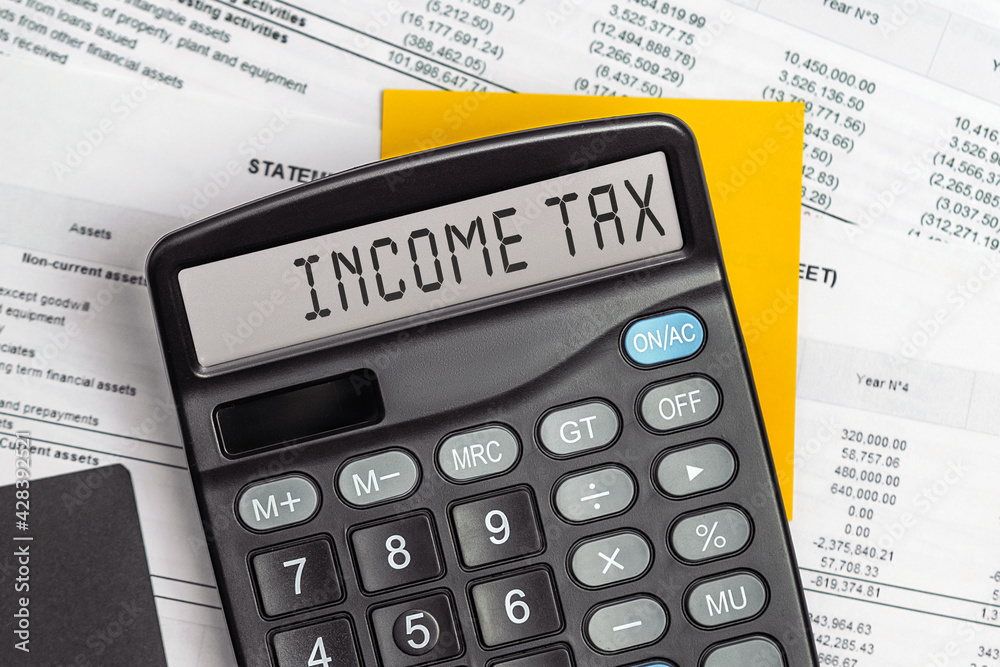 On display of calculator is written INCOME TAX On display of calculator is written INCOME TAX