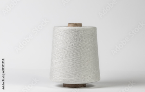 Textile white spool on isolated white background