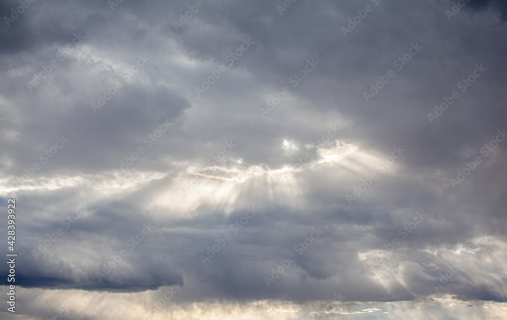 Obraz premium Dramatic sky with grey clouds over the city before the storm. Weather before or after a storm.