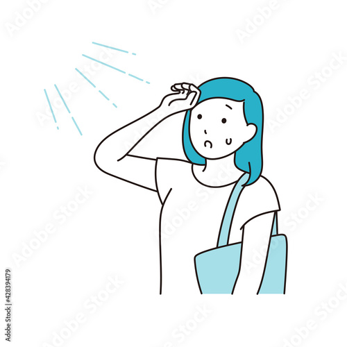 強い日差しと暑がる女性