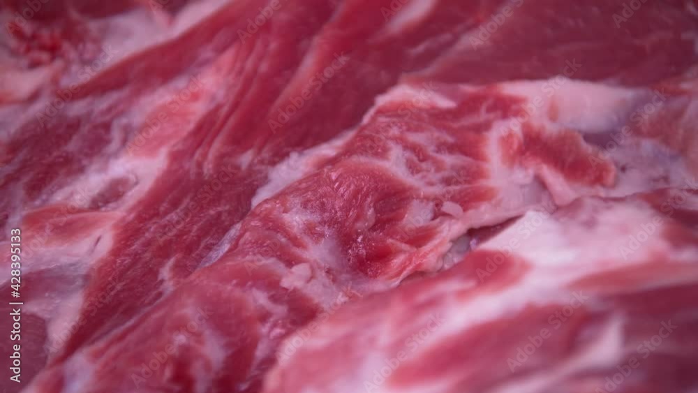 fresh raw beef fillet in refrigerated display case, fresh organic food, closeup view fresh raw beef fillet in refrigerated display case, fresh organic food, closeup view