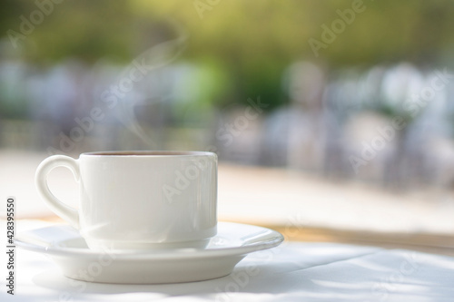 Cup of coffee on table  in terrace 