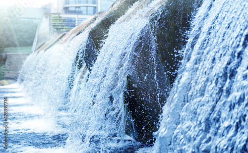 Waste water treatment plant. Modern urban wastewater treatment plant. Cold transparent water of decorative artificial waterfall photo