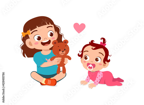 cute little girl play with baby sibling together