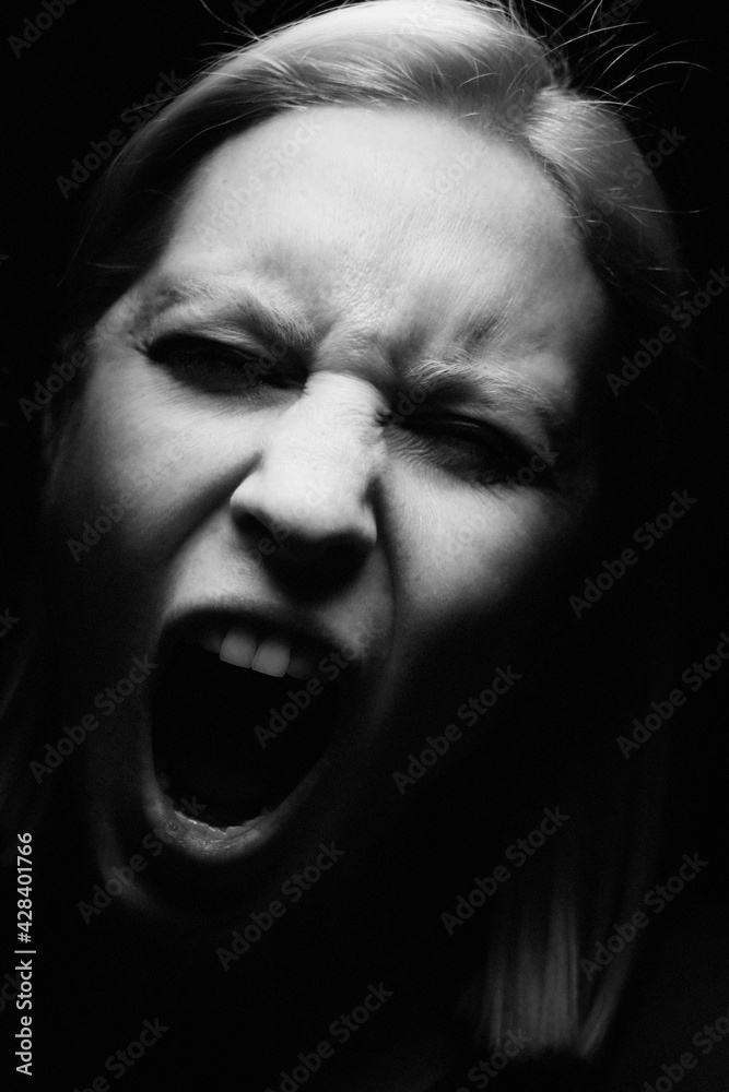 Black and white close-up portrait of young woman. Vertical. Black and white close-up portrait of young woman. Vertical.