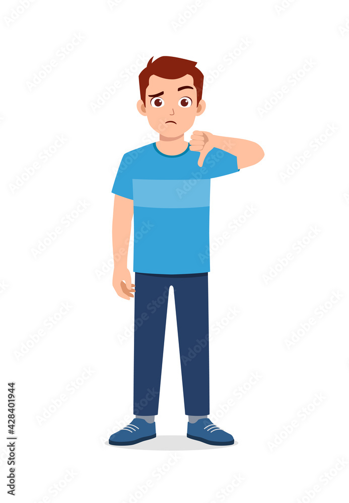 young good looking man doing thumb down pose young good looking man doing thumb down pose