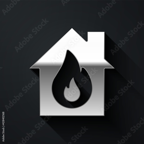 Silver Fire in burning house icon isolated on black background. Long shadow style. Vector