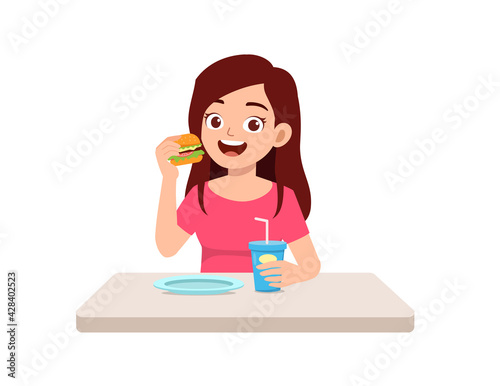 young good looking woman eat unhealthy fast food