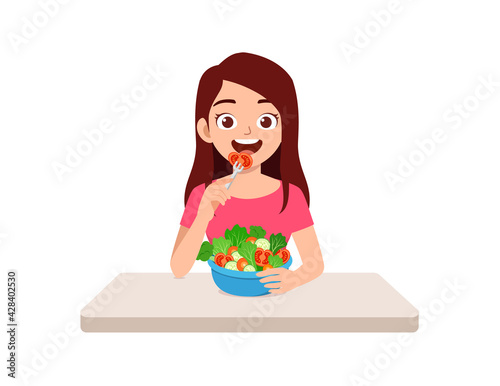 young good looking woman eat fruit and vegetable
