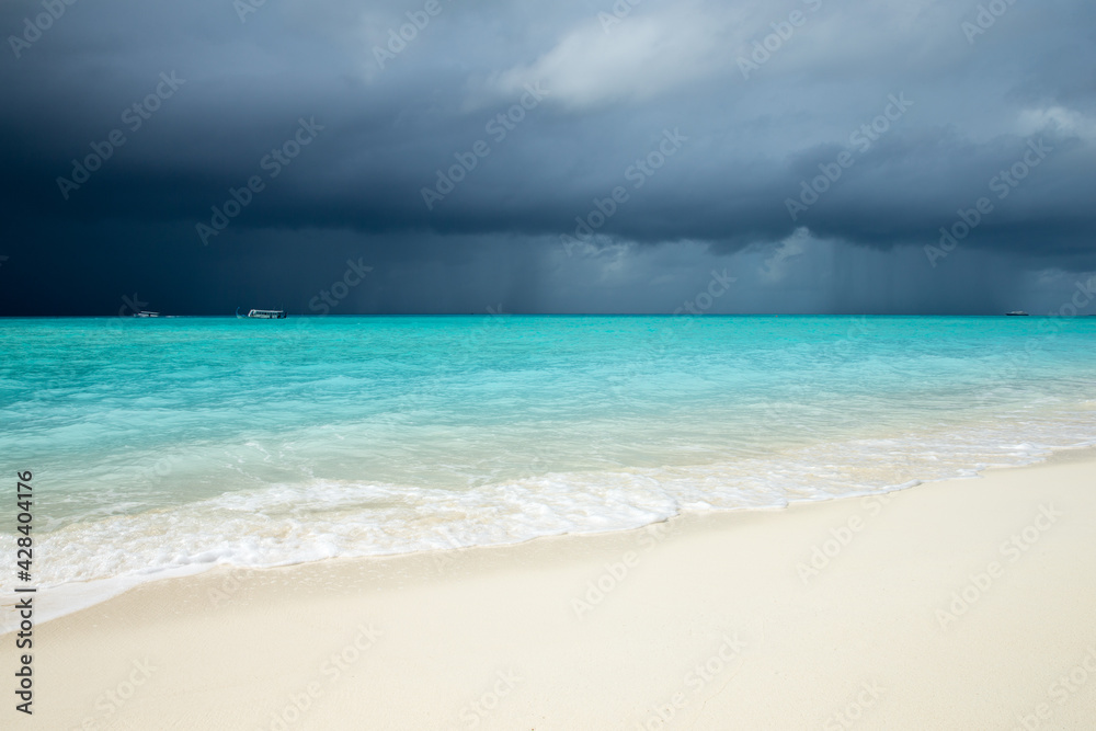 tropical Maldives island with white sandy beach and sea